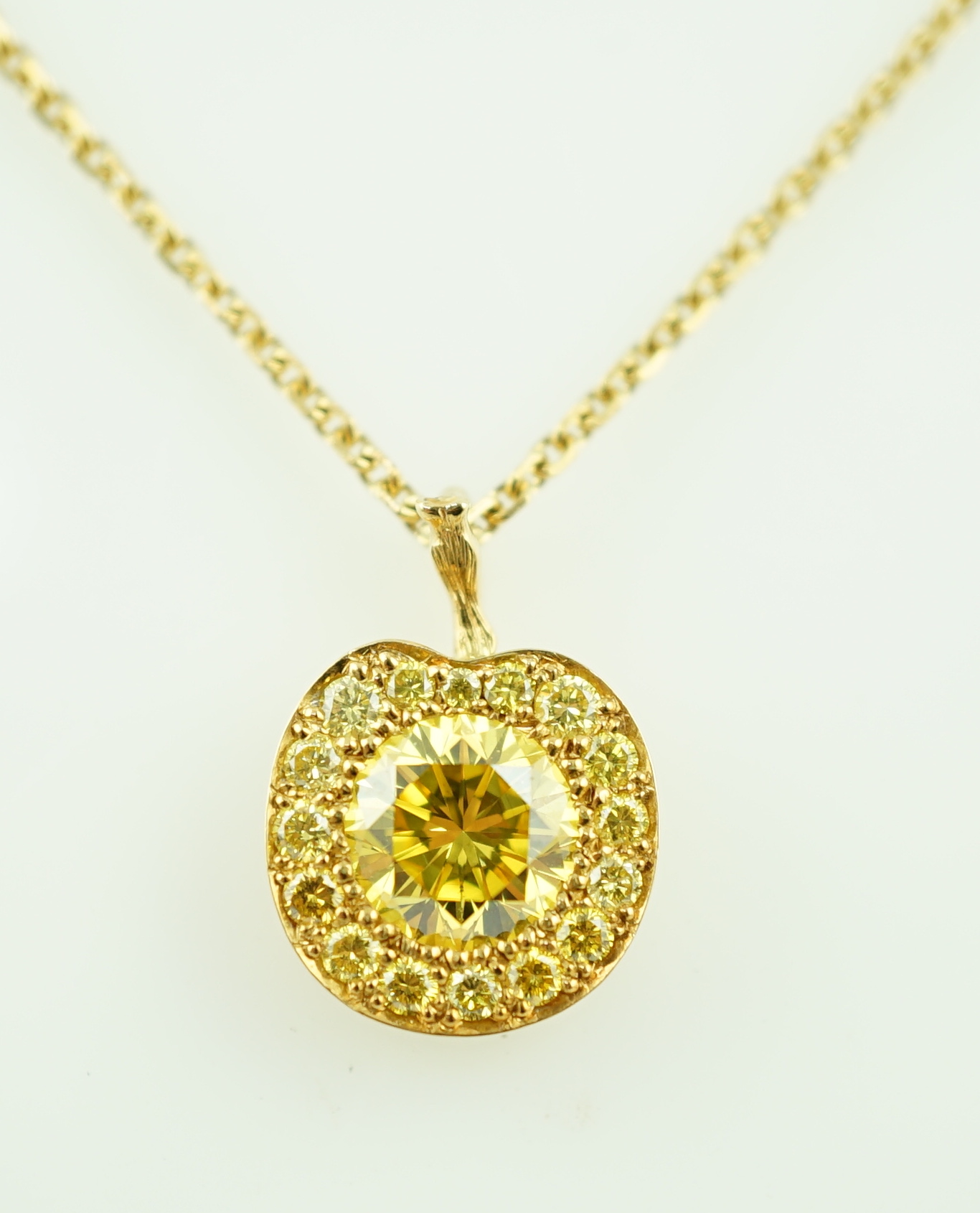 A modern Boodles 18ct gold fancy vivid yellow diamond cluster set pendant necklace on a two stone diamond set chain, with clasp and Boodles ring set with small brilliants